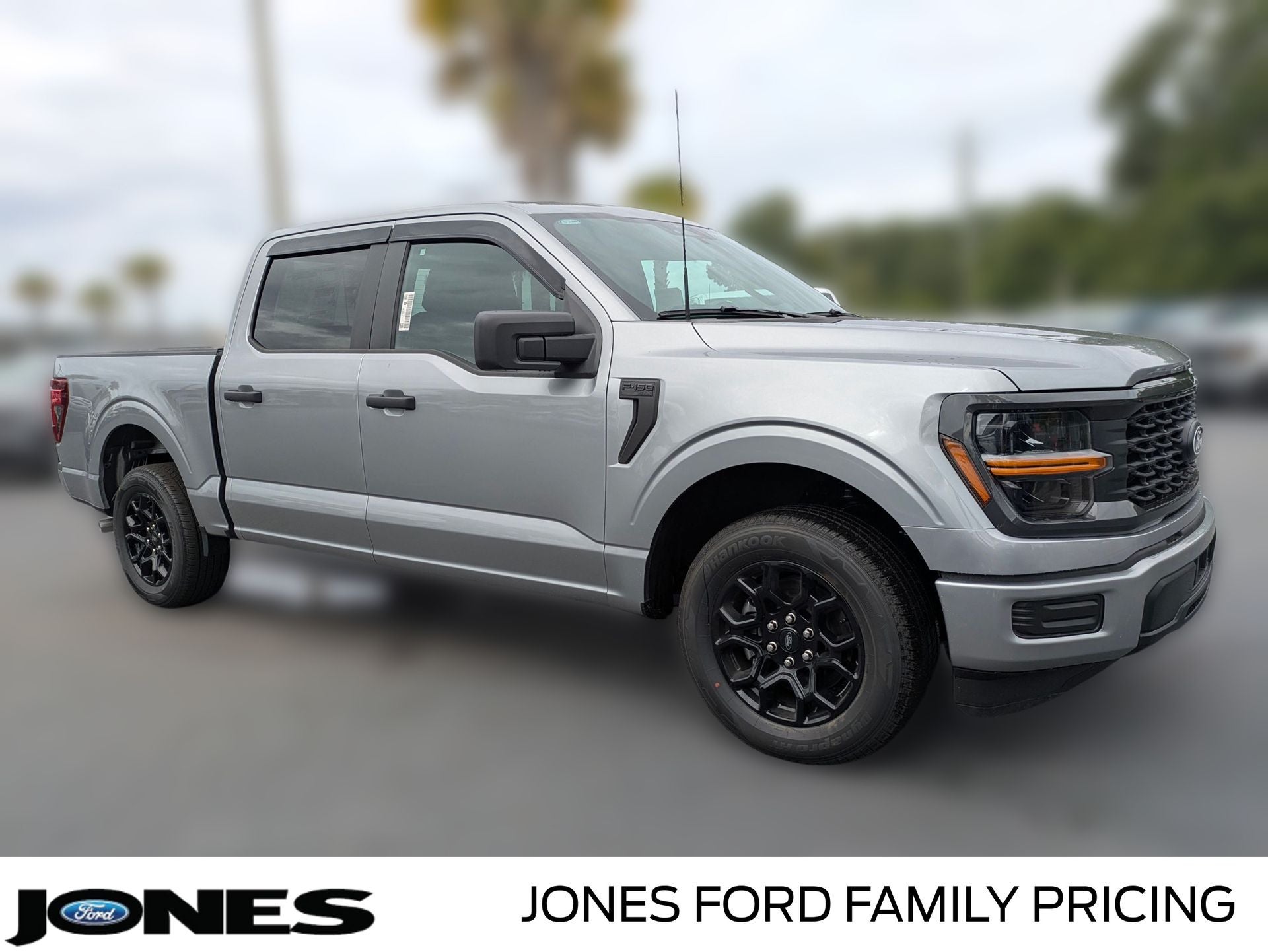 2026 Ford F-150 STX in Iconic Silver Metallic — front three-quarter view