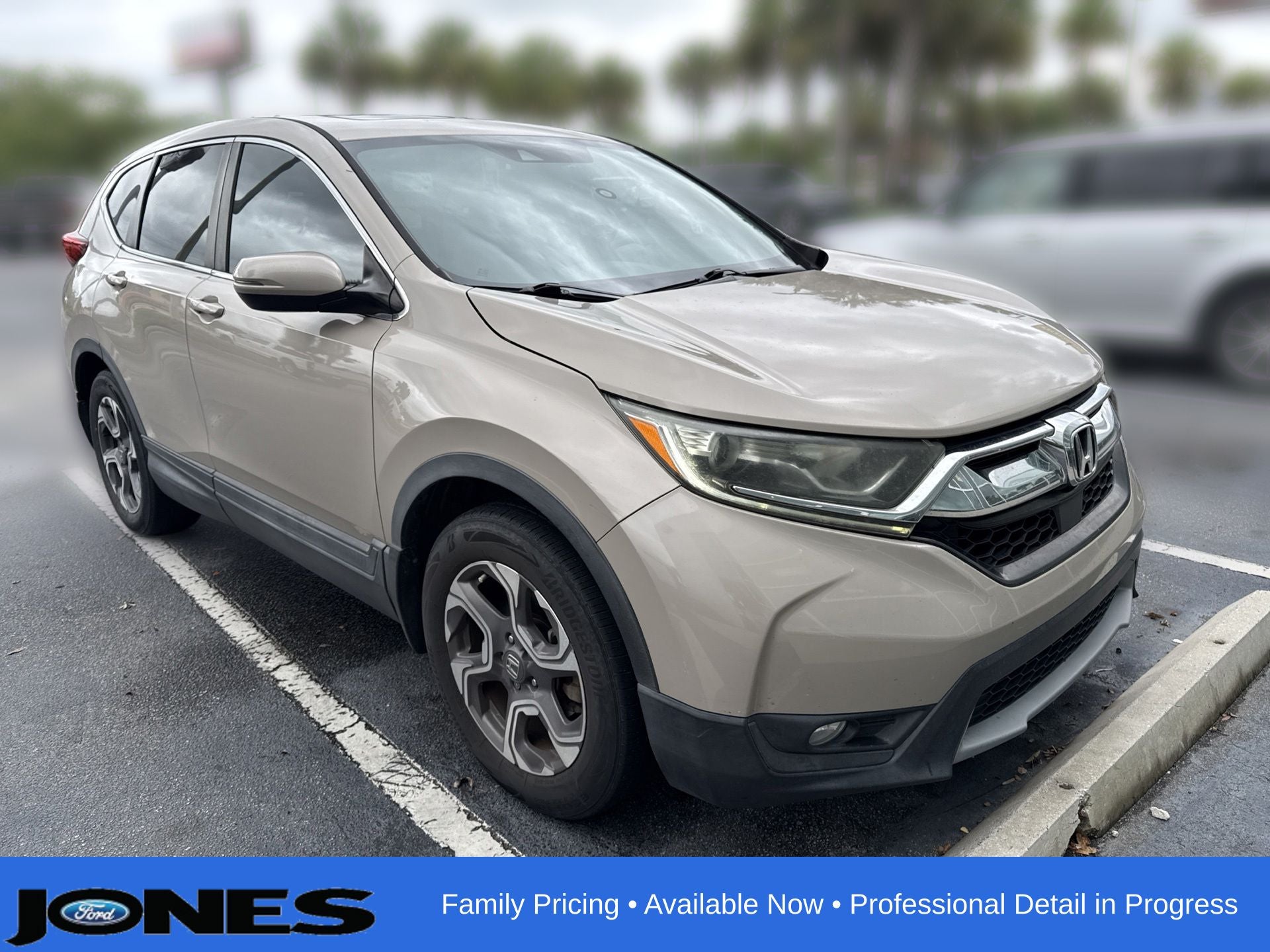 2017 Honda CR-V EX in Sandstorm Metallic — front three-quarter view